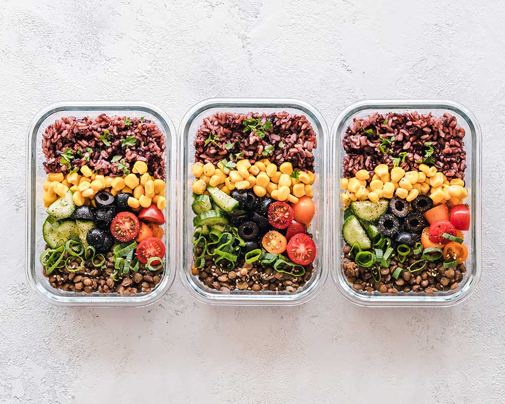 Colourful healthy meal prep boxes ready to eat